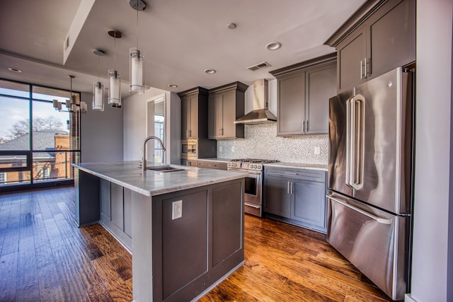 3000 Poston Ave Unit 102, Nashville, TN 37203 - kitchen with visible vents, wall chimney exhaust hood, appliances with stainless steel finishes, a sink, and backsplash