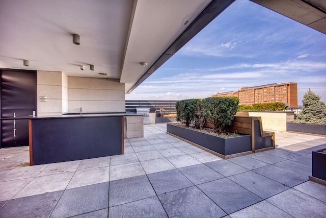 3000 Poston Ave Unit 102, Nashville, TN 37203 - view of patio featuring exterior kitchen and a sink