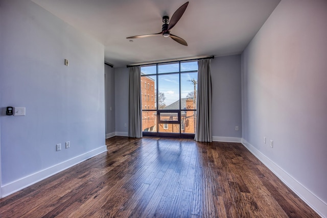 3000 Poston Ave Unit 102, Nashville, TN 37203 - empty room featuring baseboards, floor to ceiling windows, a ceiling fan, and dark wood finished floors