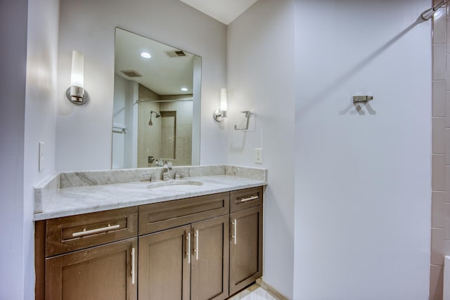 3000 Poston Ave Unit 102, Nashville, TN 37203 - bathroom with vanity, a tile shower, and visible vents