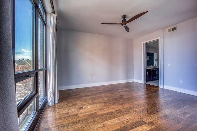 3000 Poston Ave Unit 102, Nashville, TN 37203 - empty room featuring baseboards, visible vents, a ceiling fan, and wood finished floors