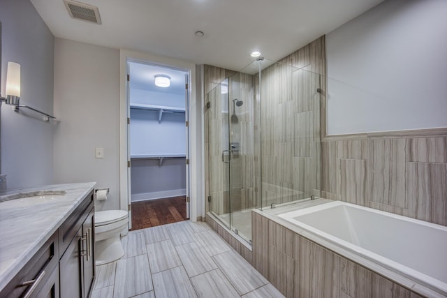 3000 Poston Ave Unit 102, Nashville, TN 37203 - bathroom with toilet, vanity, a garden tub, a shower stall, and visible vents