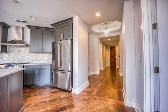 3000 Poston Ave Unit 102, Nashville, TN 37203 - kitchen featuring light countertops, backsplash, high end fridge, wall chimney range hood, and visible vents