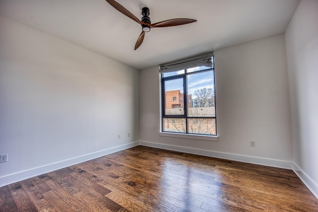 3000 Poston Ave Unit 102, Nashville, TN 37203 - spare room with baseboards, dark wood-type flooring, and a ceiling fan