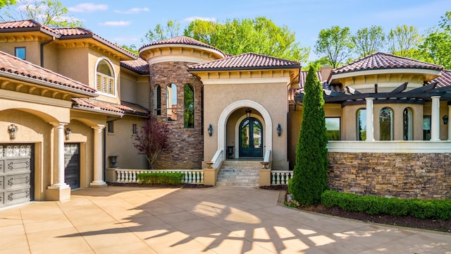 947 Tyne Blvd, Nashville, TN 37220 - mediterranean / spanish home with french doors, a tiled roof, driveway, and stucco siding