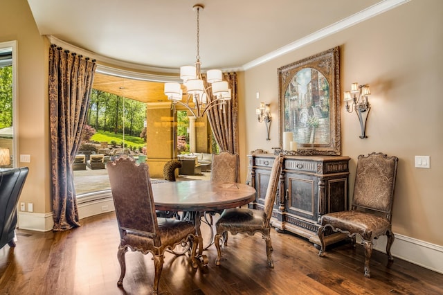 947 Tyne Blvd, Nashville, TN 37220 - dining area featuring baseboards, crown molding, a notable chandelier, and wood finished floors