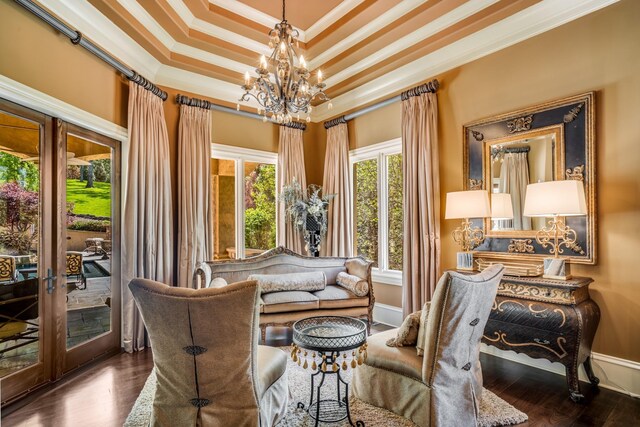 947 Tyne Blvd, Nashville, TN 37220 - living area with a tray ceiling, an inviting chandelier, ornamental molding, baseboards, and wood finished floors