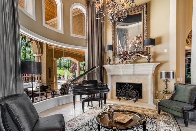 947 Tyne Blvd, Nashville, TN 37220 - sitting room featuring a towering ceiling, a notable chandelier, tile patterned flooring, and a premium fireplace