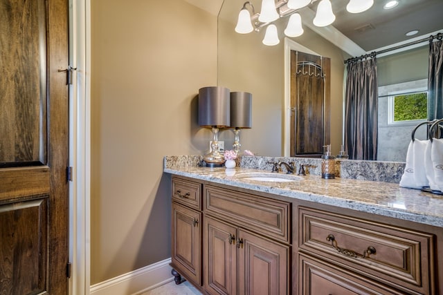 947 Tyne Blvd, Nashville, TN 37220 - bathroom with baseboards, visible vents, and vanity