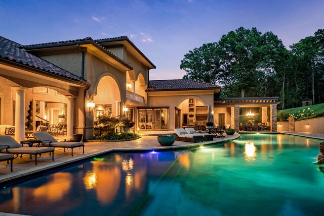 947 Tyne Blvd, Nashville, TN 37220 - outdoor pool featuring a fireplace and a patio area