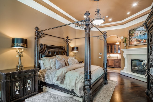 947 Tyne Blvd, Nashville, TN 37220 - bedroom with recessed lighting, ornamental molding, wood finished floors, and a glass covered fireplace