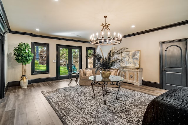 947 Tyne Blvd, Nashville, TN 37220 - interior space with baseboards, a notable chandelier, wood finished floors, and ornamental molding