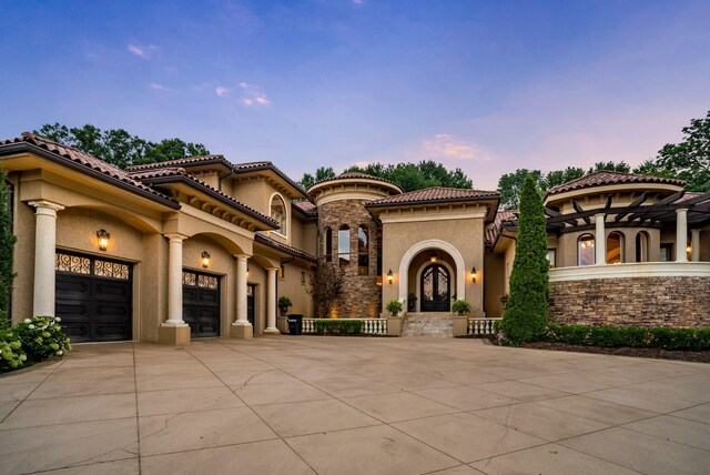 947 Tyne Blvd, Nashville, TN 37220 - mediterranean / spanish home with a tiled roof, a garage, driveway, and stucco siding