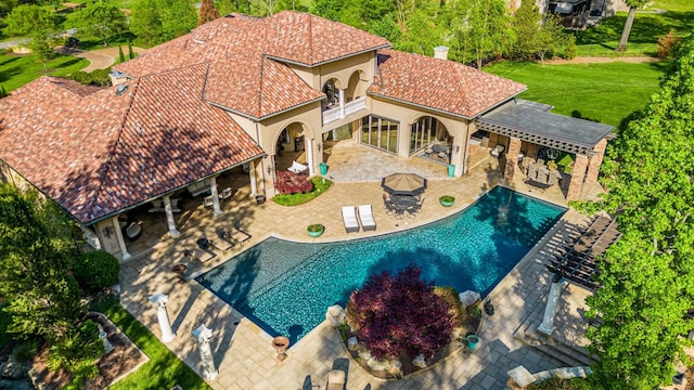 947 Tyne Blvd, Nashville, TN 37220 - outdoor pool with outdoor dry bar, an outdoor hangout area, a yard, and a patio area