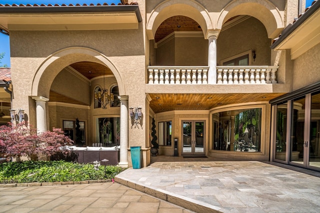 947 Tyne Blvd, Nashville, TN 37220 - view of exterior entry with a balcony, french doors, and stucco siding