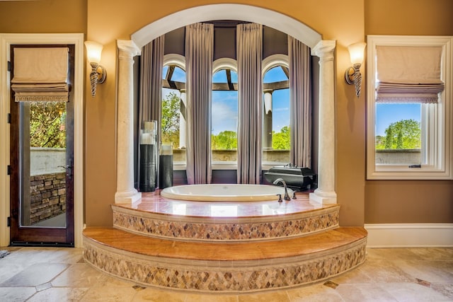 947 Tyne Blvd, Nashville, TN 37220 - full bathroom with baseboards, a garden tub, and decorative columns