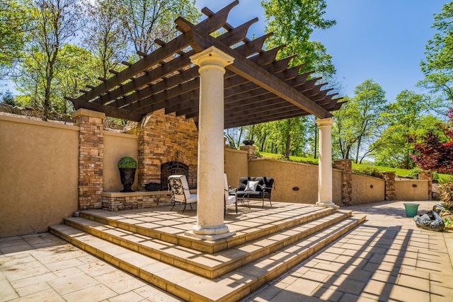 947 Tyne Blvd, Nashville, TN 37220 - view of patio / terrace featuring a pergola, an outdoor stone fireplace, and fence