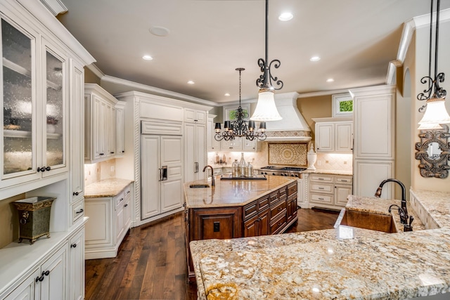 947 Tyne Blvd, Nashville, TN 37220 - kitchen with custom exhaust hood, ornamental molding, paneled refrigerator, and a sink