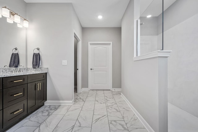 bathroom featuring baseboards, vanity, recessed lighting, and marble finish floor