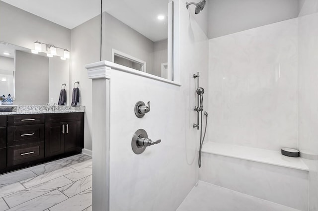 bathroom with a walk in shower, recessed lighting, marble finish floor, and vanity