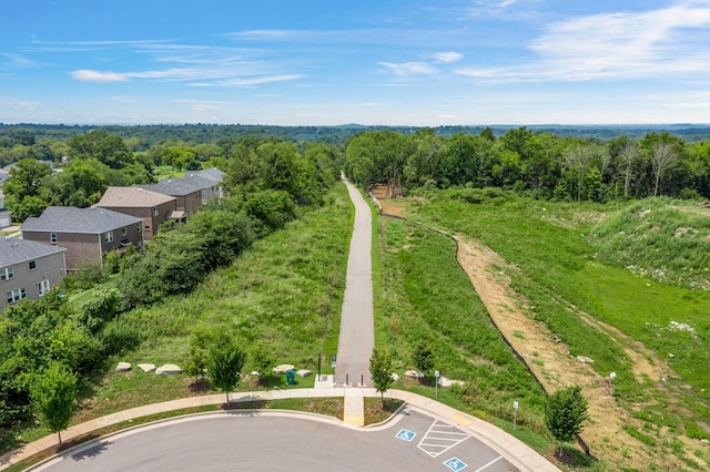 aerial view featuring a wooded view