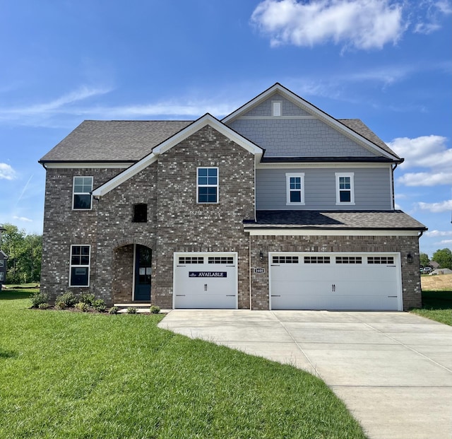 view of front of property featuring driveway, brick siding, an attached garage, and a front lawn