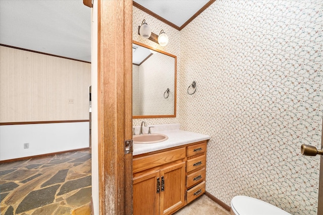 5651 S York Hwy, Grimsley, TN 38565 - bathroom featuring toilet, wallpapered walls, vanity, and crown molding