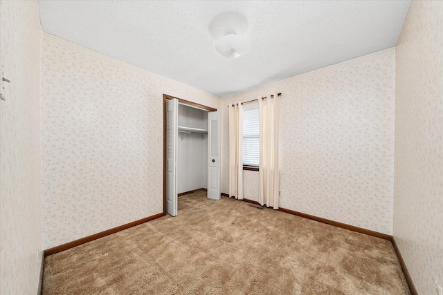 5651 S York Hwy, Grimsley, TN 38565 - unfurnished bedroom featuring baseboards, wallpapered walls, crown molding, and carpet flooring