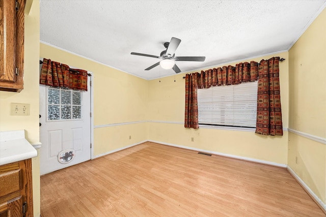 5651 S York Hwy, Grimsley, TN 38565 - empty room featuring light wood-type flooring, baseboards, a textured ceiling, visible vents, and ceiling fan