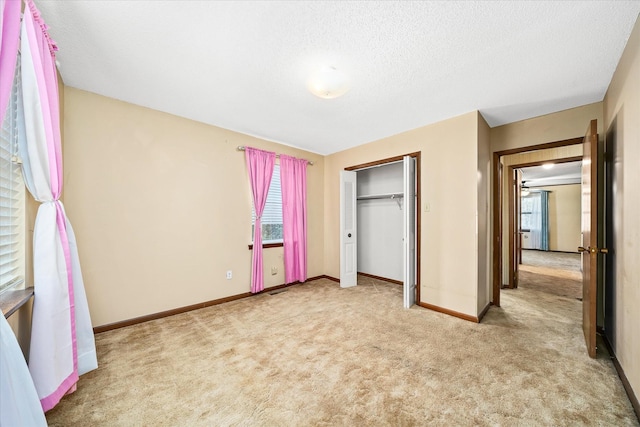 5651 S York Hwy, Grimsley, TN 38565 - unfurnished bedroom featuring baseboards, a closet, carpet floors, and a textured ceiling
