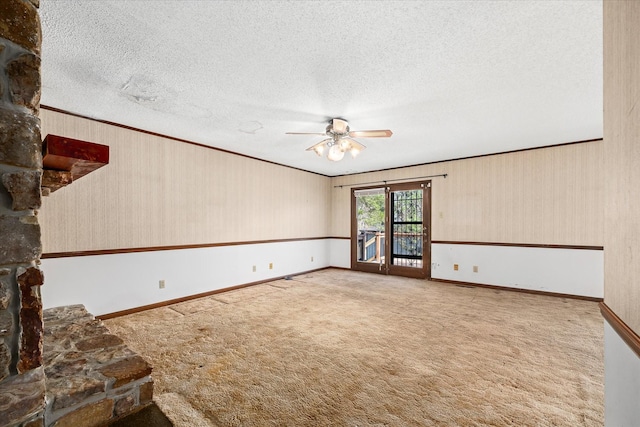5651 S York Hwy, Grimsley, TN 38565 - empty room with a textured ceiling, crown molding, carpet, baseboards, and a ceiling fan