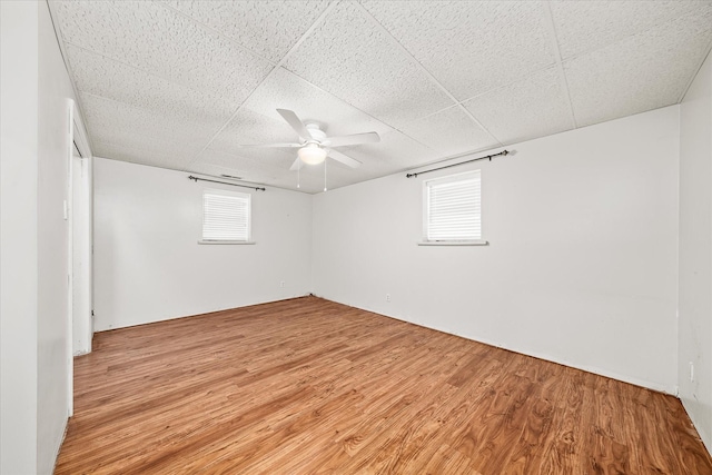 5651 S York Hwy, Grimsley, TN 38565 - spare room featuring ceiling fan, a paneled ceiling, and light wood-type flooring