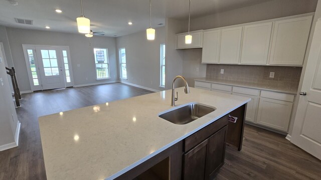 6139 Saxlingham Pl, Smyrna, TN 37167 - kitchen with visible vents, dark wood-style flooring, ceiling fan, an island with sink, and a sink
