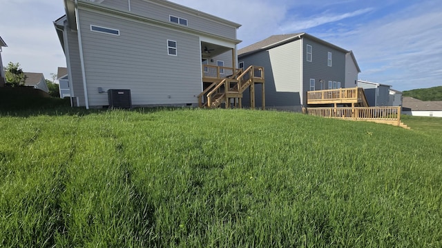 6139 Saxlingham Pl, Smyrna, TN 37167 - rear view of house with stairs, a wooden deck, ceiling fan, cooling unit, and a yard
