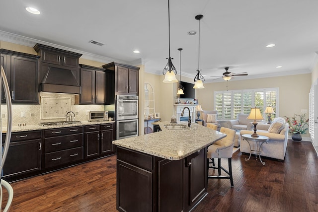 1019 Club View Dr, Gallatin, TN 37066 - kitchen featuring visible vents, appliances with stainless steel finishes, a sink, custom range hood, and open floor plan