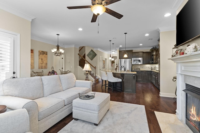 1019 Club View Dr, Gallatin, TN 37066 - living area with a premium fireplace, recessed lighting, ornamental molding, ceiling fan with notable chandelier, and dark wood finished floors