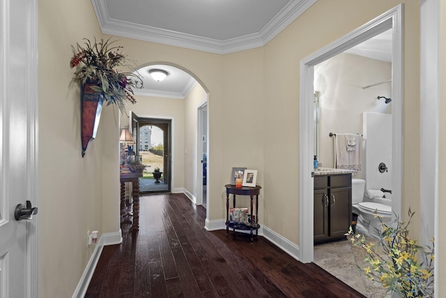 1019 Club View Dr, Gallatin, TN 37066 - hall with ornamental molding, arched walkways, baseboards, and dark wood finished floors