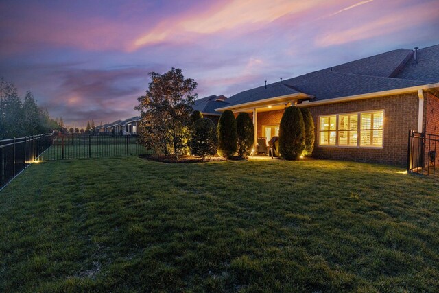 1019 Club View Dr, Gallatin, TN 37066 - rear view of property with a fenced backyard, brick siding, roof with shingles, and a yard