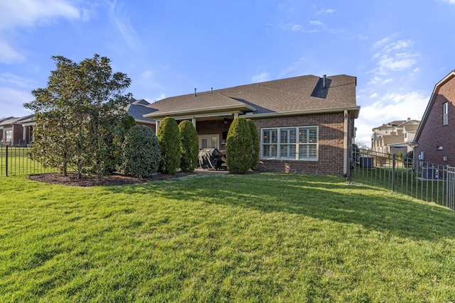 1019 Club View Dr, Gallatin, TN 37066 - view of front facade with brick siding, fence, central AC unit, and a front yard