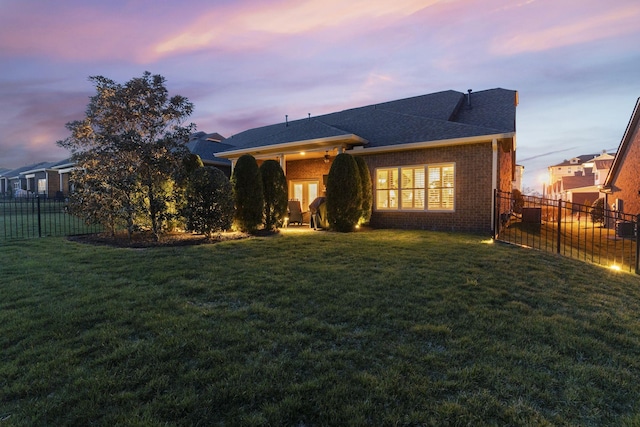 1019 Club View Dr, Gallatin, TN 37066 - view of front facade with a fenced backyard, brick siding, and a yard