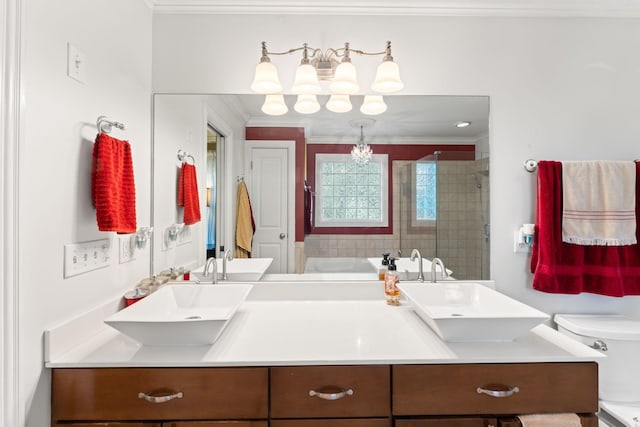 bathroom featuring ornamental molding, a sink, toilet, and a shower stall