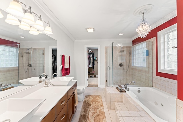 bathroom with a sink, a notable chandelier, crown molding, and a stall shower