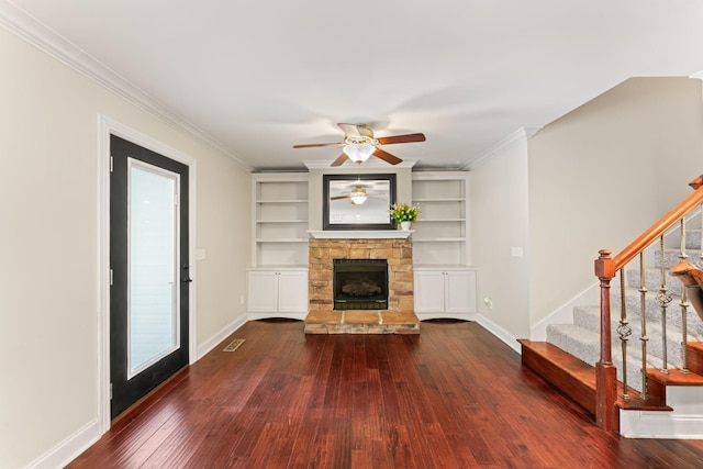 unfurnished living room featuring stairs, ceiling fan, baseboards, and dark wood-style floors