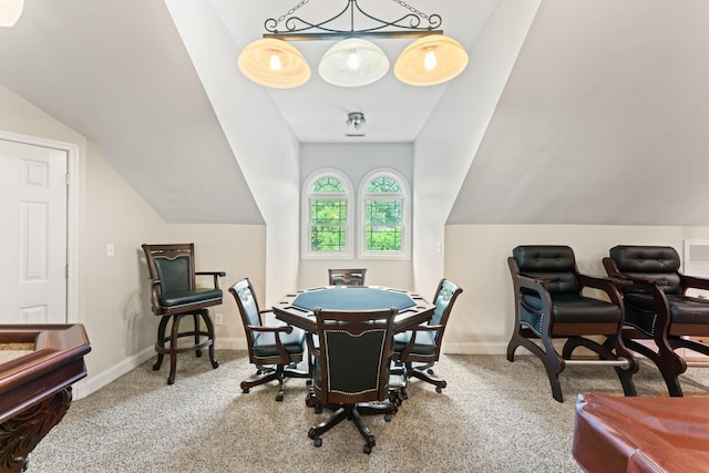 carpeted home office featuring baseboards and vaulted ceiling