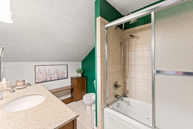 full bathroom featuring tile patterned flooring, shower / bath combination with glass door, vanity, vaulted ceiling, and toilet