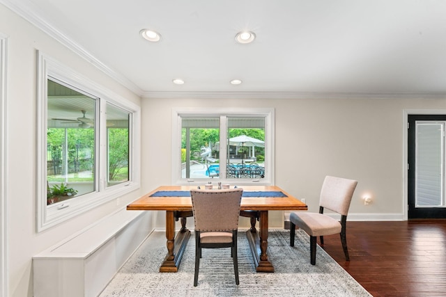 dining room with dark wood finished floors, baseboards, recessed lighting, and ornamental molding