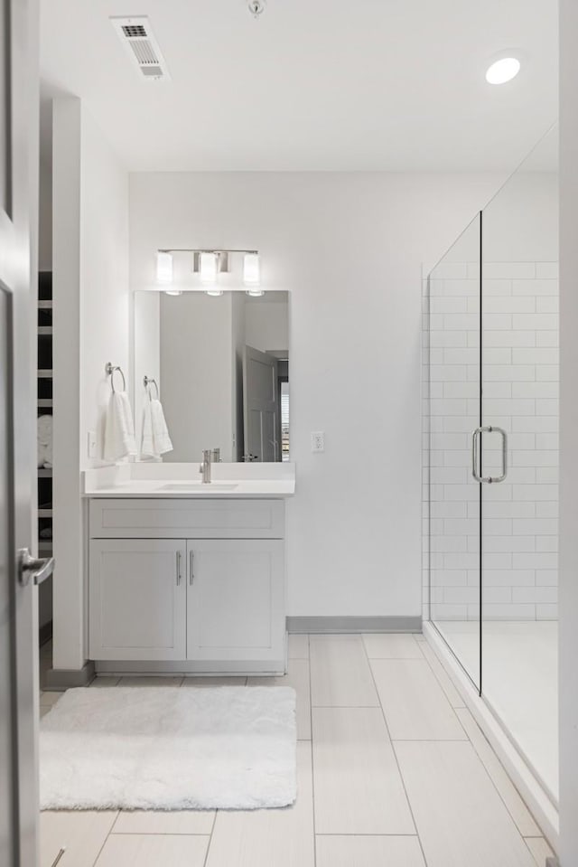 1638 54th Ave N Unit 313, Nashville, TN 37209 - bathroom with tile patterned flooring, vanity, a stall shower, and visible vents