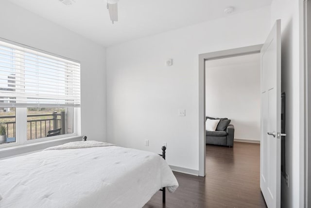 1638 54th Ave N Unit 313, Nashville, TN 37209 - bedroom with baseboards, a ceiling fan, and dark wood finished floors