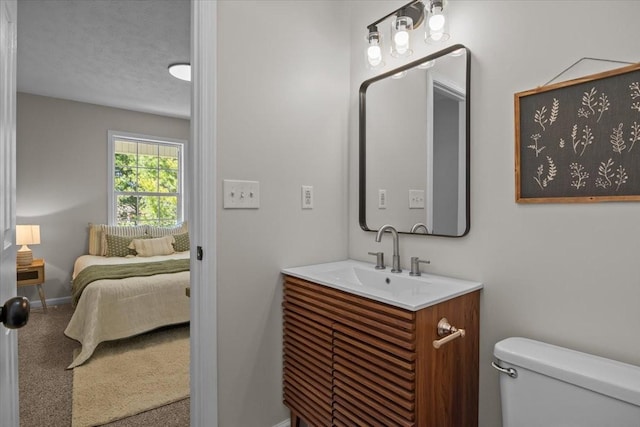 650 Wall Rd, Cunningham, TN 37052 - ensuite bathroom featuring toilet, vanity, a textured ceiling, ensuite bath, and baseboards