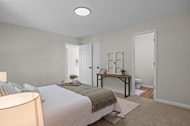 650 Wall Rd, Cunningham, TN 37052 - carpeted bedroom featuring ensuite bathroom and baseboards
